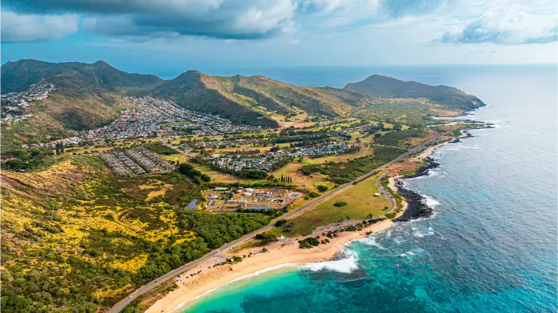 Ocean Meeting Land Bare Rocks Coast Curved By Waves Shore Oahu Hawaii USA Aerial